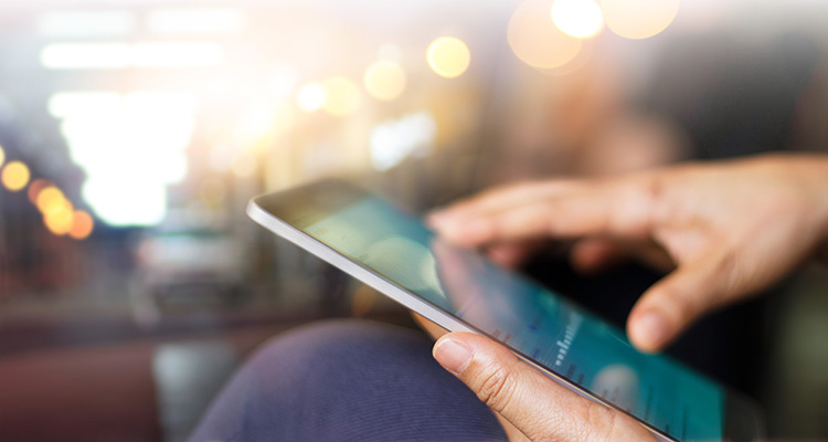 Businessman using tablet at night time