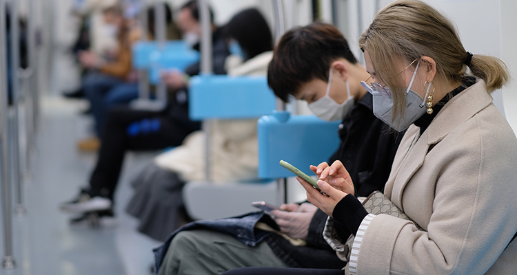 Many people wearing surgical mask sitting in subway in China